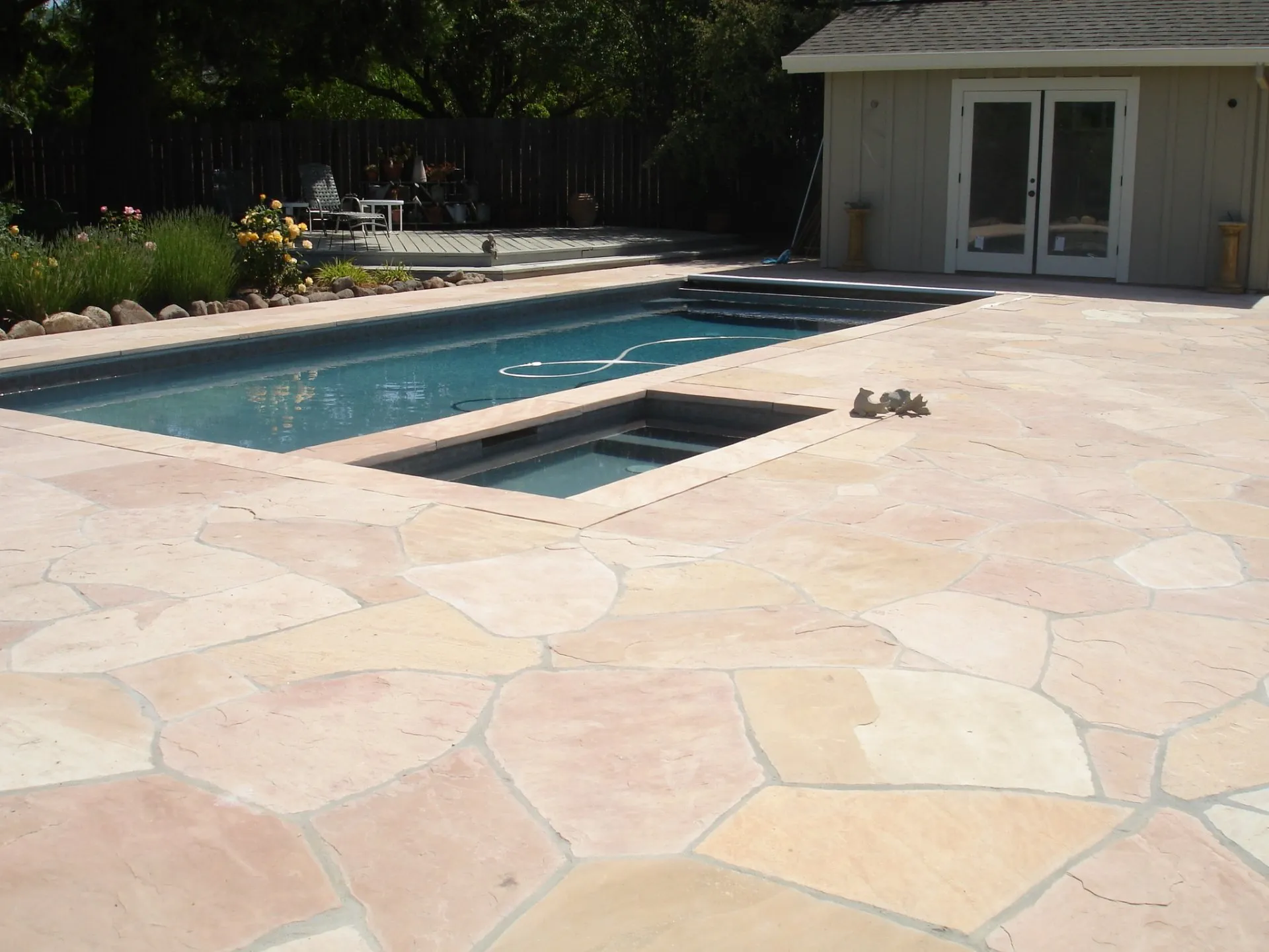 Flagstone pool by Eternal Landscape Solutions